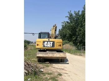 حفار ذو عجلات CATERPILLAR