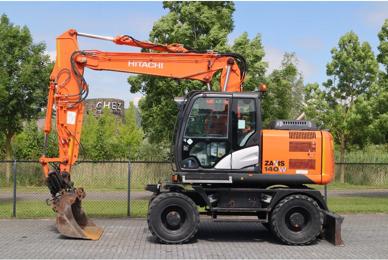 Hitachi ZX 140 W-5B | TILT QC | BUCKET | DOZER BLADE | DUTCH REG. - حفار ذو عجلات: صورة 1 Hitachi ZX 140 W-5B | TILT QC | BUCKET | DOZER BLADE | DUTCH REG. - حفار ذو عجلات: صورة 1