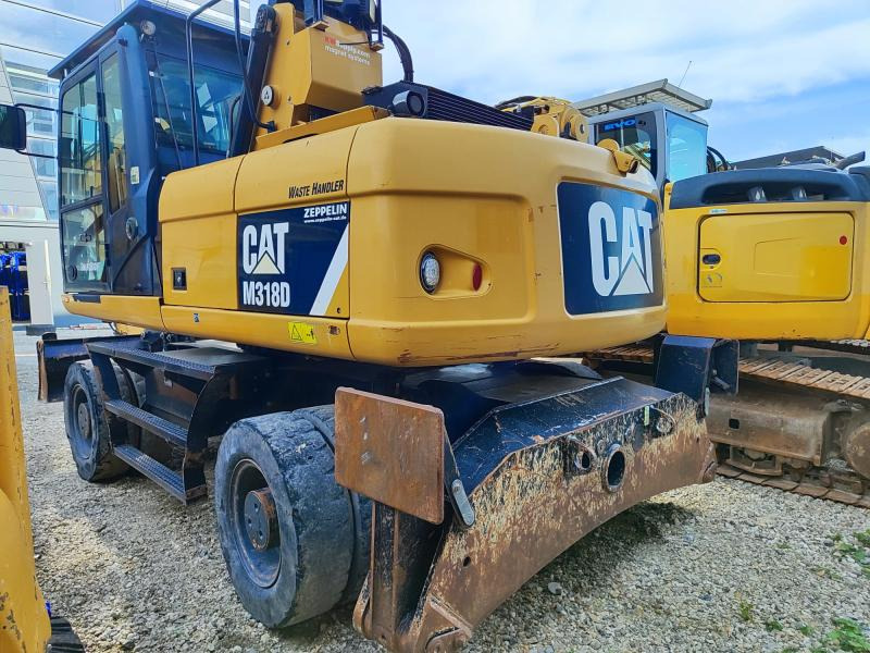 Caterpillar M318D MH - حفار ذو عجلات: صورة 1 Caterpillar M318D MH - حفار ذو عجلات: صورة 1