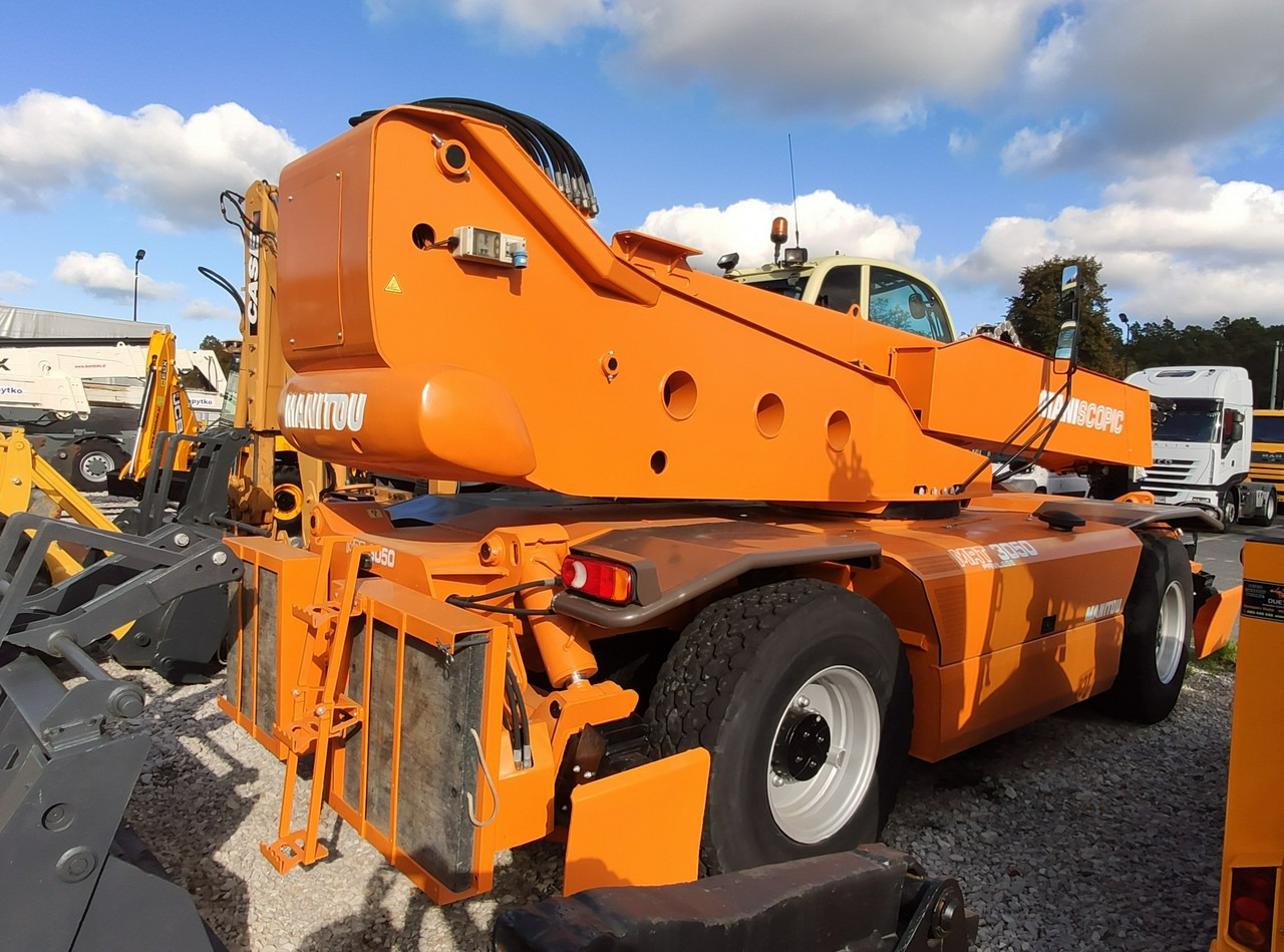 Manitou Wózek Jezdniowy Podnośnikowy Obrotowy - آلة رفع ونقل تلسكوبية: صورة 3 Manitou Wózek Jezdniowy Podnośnikowy Obrotowy - آلة رفع ونقل تلسكوبية: صورة 3