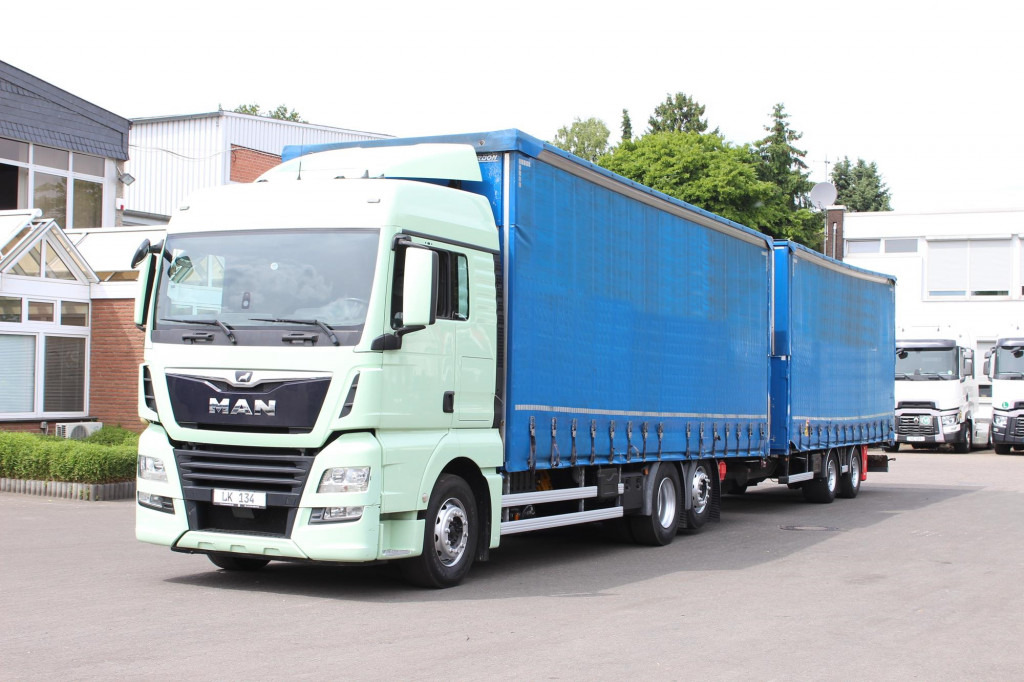 MAN TGX 26.460 Retarder Jumbo-Zug 120M3 Durchlade - شاحنة ذات ستائر جانبية: صورة 1 MAN TGX 26.460 Retarder Jumbo-Zug 120M3 Durchlade - شاحنة ذات ستائر جانبية: صورة 1