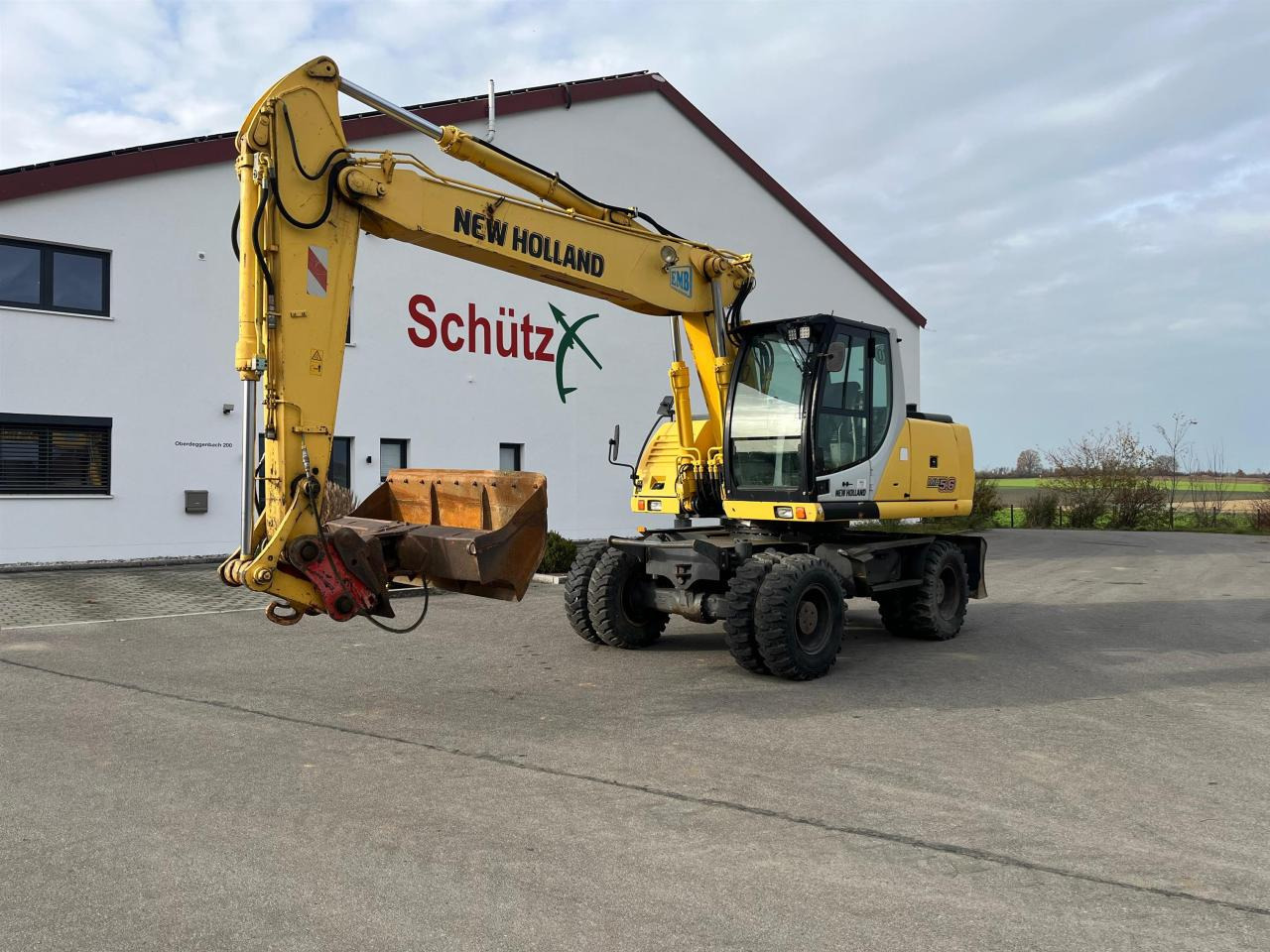 New Holland MH 5.6 inkl. Grabenlöffel, Tieflöffel - حفار ذو عجلات: صورة 1 New Holland MH 5.6 inkl. Grabenlöffel, Tieflöffel - حفار ذو عجلات: صورة 1