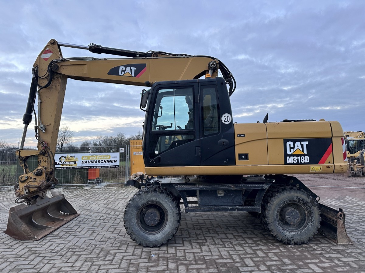 CATERPILLAR M 318 D full Hydr. Top Zustand German machine ! - حفار ذو عجلات: صورة 1 CATERPILLAR M 318 D full Hydr. Top Zustand German machine ! - حفار ذو عجلات: صورة 1