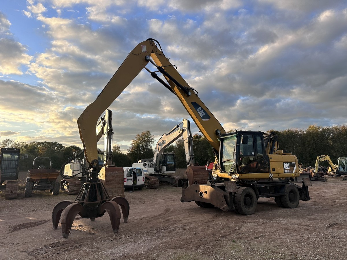 CATERPILLAR M 318 MH mit Greifer Kein 3022 3026 320 322 - حفار ذو عجلات: صورة 1 CATERPILLAR M 318 MH mit Greifer Kein 3022 3026 320 322 - حفار ذو عجلات: صورة 1