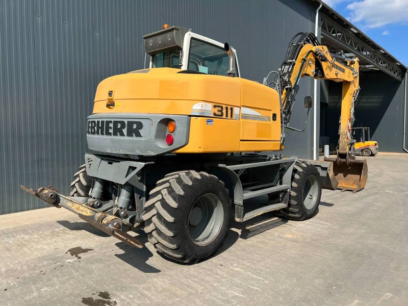 Liebherr A311 Litronic - حفار ذو عجلات: صورة 4 Liebherr A311 Litronic - حفار ذو عجلات: صورة 4