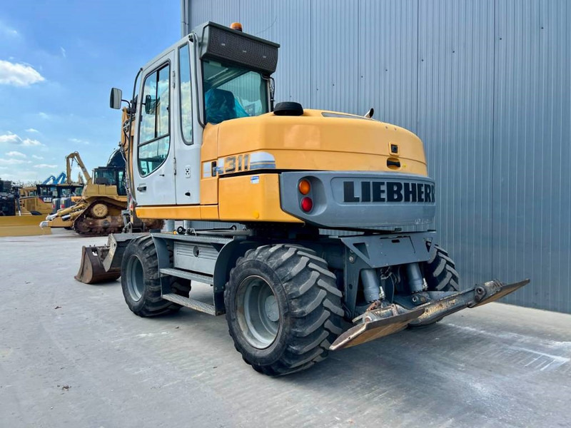 Liebherr A311 Litronic - حفار ذو عجلات: صورة 2 Liebherr A311 Litronic - حفار ذو عجلات: صورة 2