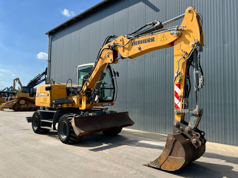 Liebherr A311 Litronic - حفار ذو عجلات: صورة 3 Liebherr A311 Litronic - حفار ذو عجلات: صورة 3