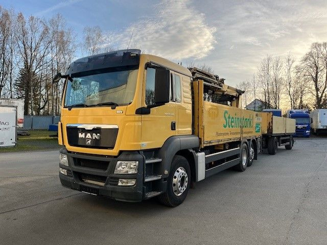 MAN TGS 26.400 Baustoff LKW mit Ladekran Atlas 210.2 - شاحنات مسطحة, شاحنة كرين: صورة 1 MAN TGS 26.400 Baustoff LKW mit Ladekran Atlas 210.2 - شاحنات مسطحة, شاحنة كرين: صورة 1