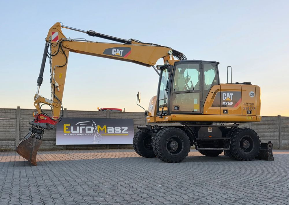 Caterpillar M314F, 2018 ROK, 4200 MTH, 2 ŁYŻKI - حفار ذو عجلات: صورة 1 Caterpillar M314F, 2018 ROK, 4200 MTH, 2 ŁYŻKI - حفار ذو عجلات: صورة 1