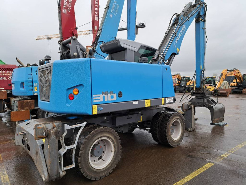 Fuchs MHL310F + Grapple - آلة التعامل مع النفايات: صورة 1 Fuchs MHL310F + Grapple - آلة التعامل مع النفايات: صورة 1