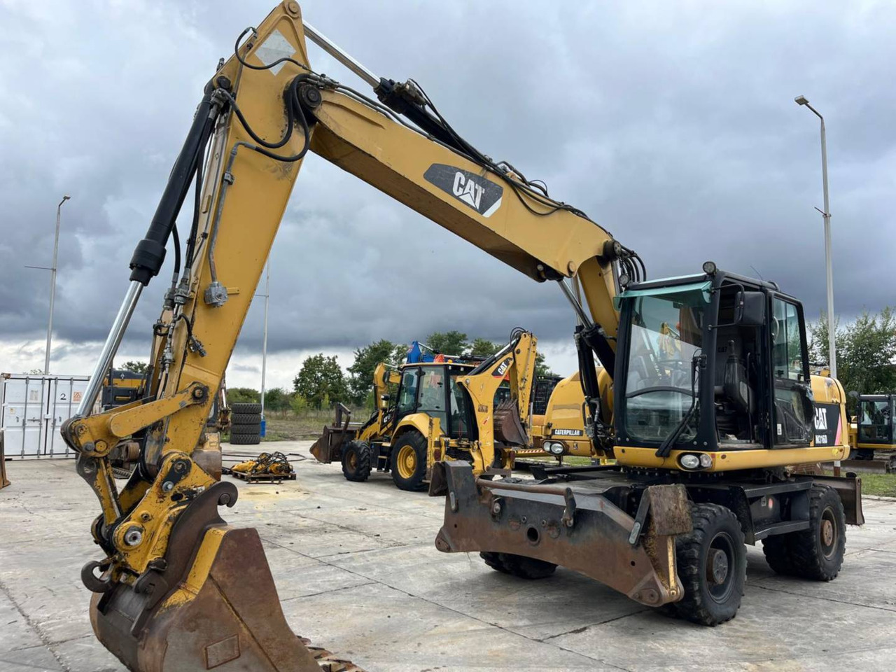 CAT M316D - حفار ذو عجلات: صورة 1 CAT M316D - حفار ذو عجلات: صورة 1