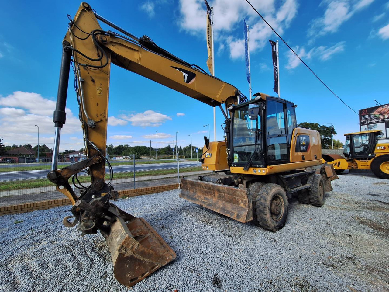 CAT M318F - حفار ذو عجلات: صورة 1 CAT M318F - حفار ذو عجلات: صورة 1