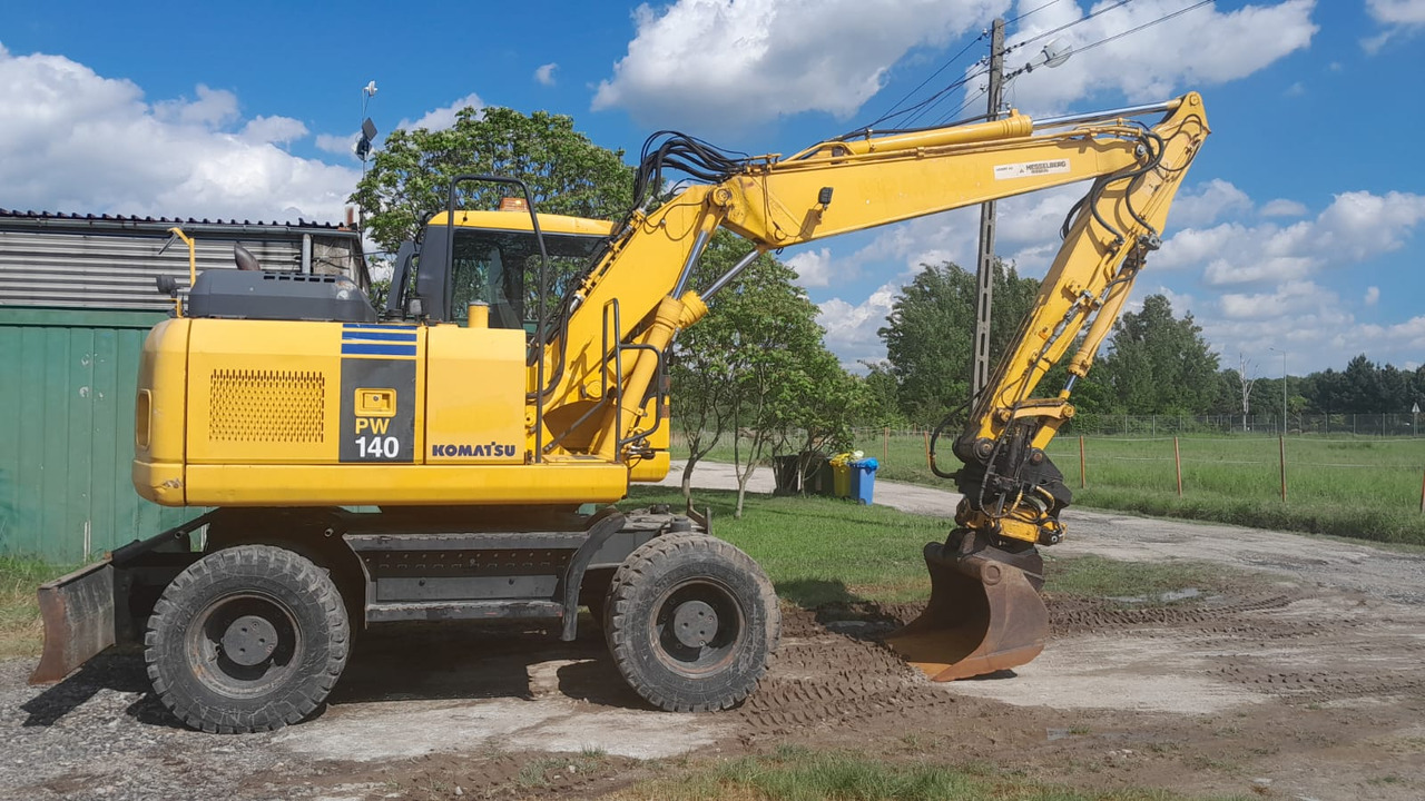 KOMATSU PW 140-7 - حفار ذو عجلات: صورة 1 KOMATSU PW 140-7 - حفار ذو عجلات: صورة 1