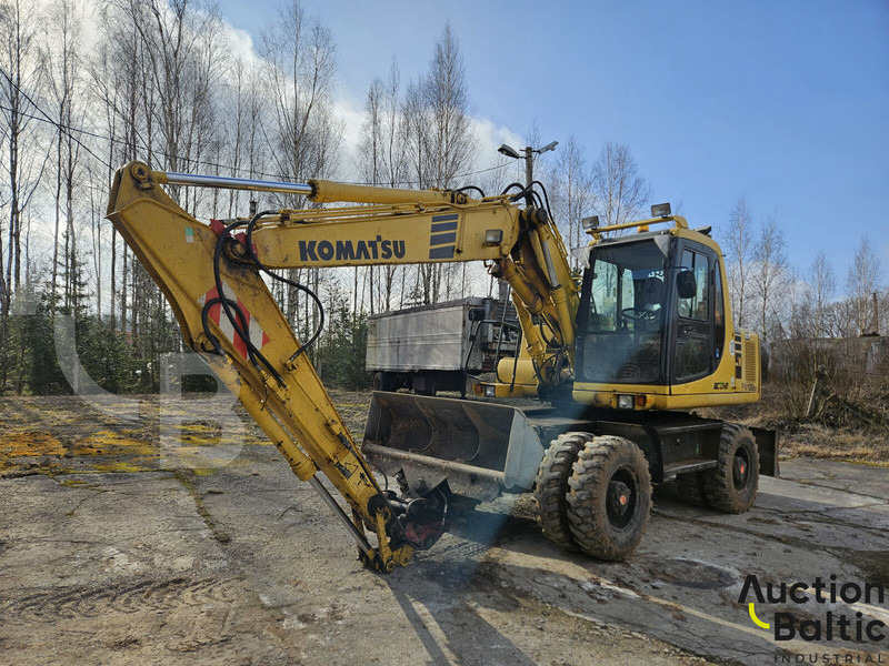 Komatsu PW130ES-6K - حفار ذو عجلات: صورة 1 Komatsu PW130ES-6K - حفار ذو عجلات: صورة 1