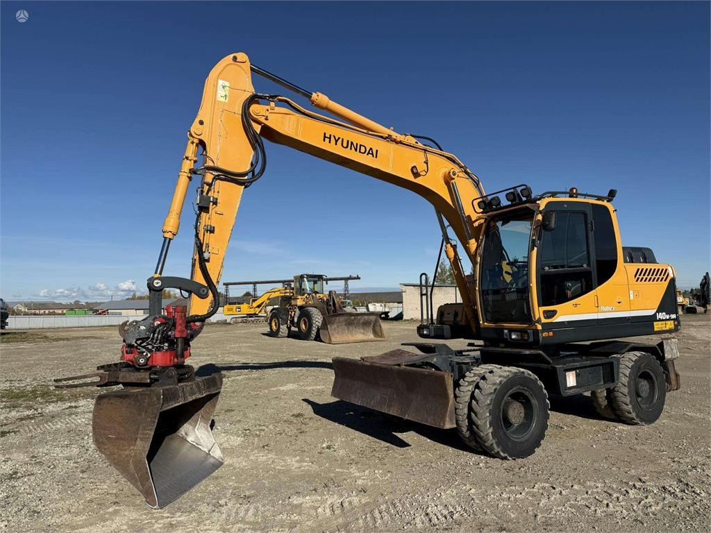 Hyundai Robex 140 W-9A Rototilt + grap - حفار ذو عجلات: صورة 1 Hyundai Robex 140 W-9A Rototilt + grap - حفار ذو عجلات: صورة 1