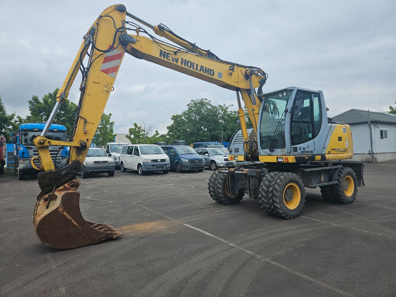 New Holland MH Plus 18t Mobilbagger - حفار ذو عجلات: صورة 1 New Holland MH Plus 18t Mobilbagger - حفار ذو عجلات: صورة 1