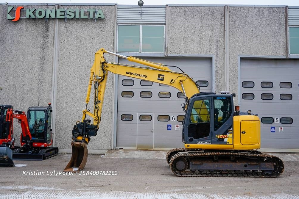 New Holland E140CSR PYÖRITTÄJÄLLÄ - حفار زاحف: صورة 1 New Holland E140CSR PYÖRITTÄJÄLLÄ - حفار زاحف: صورة 1