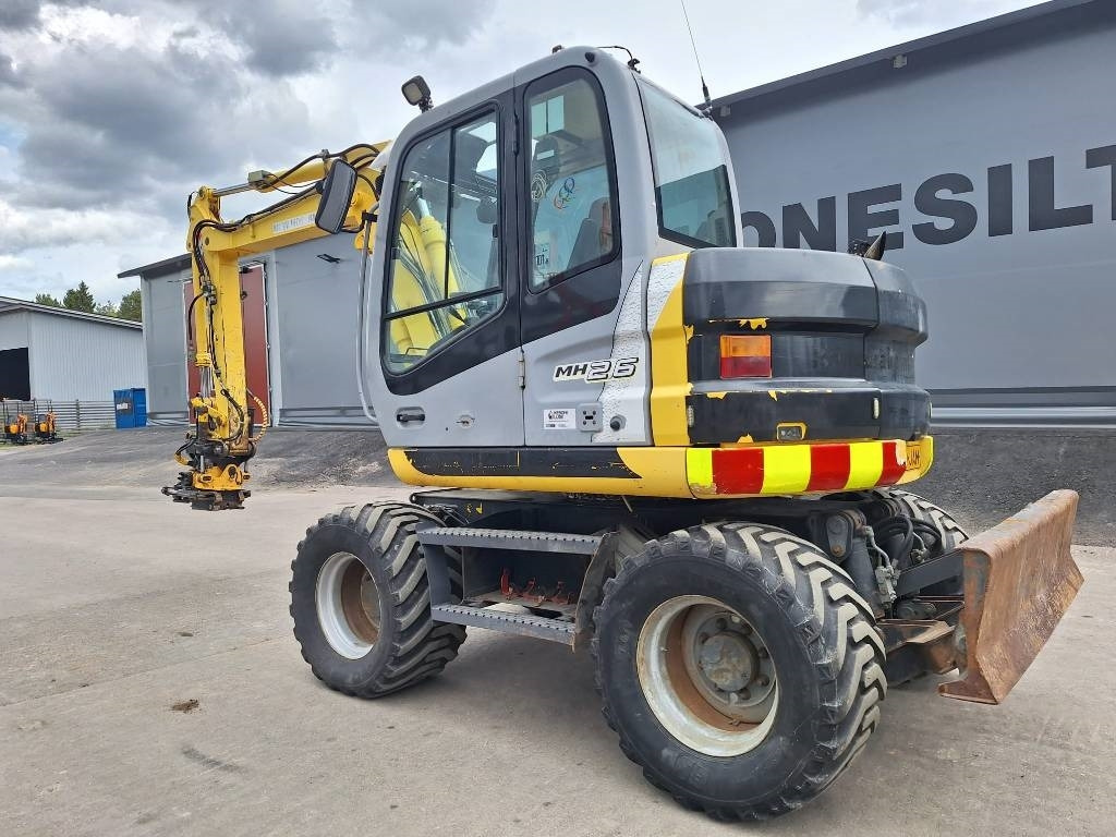 New Holland MYYTY! SOLD! MH2.6 ENGCON PIHDEILLÄ - حفار ذو عجلات: صورة 2 New Holland MYYTY! SOLD! MH2.6 ENGCON PIHDEILLÄ - حفار ذو عجلات: صورة 2