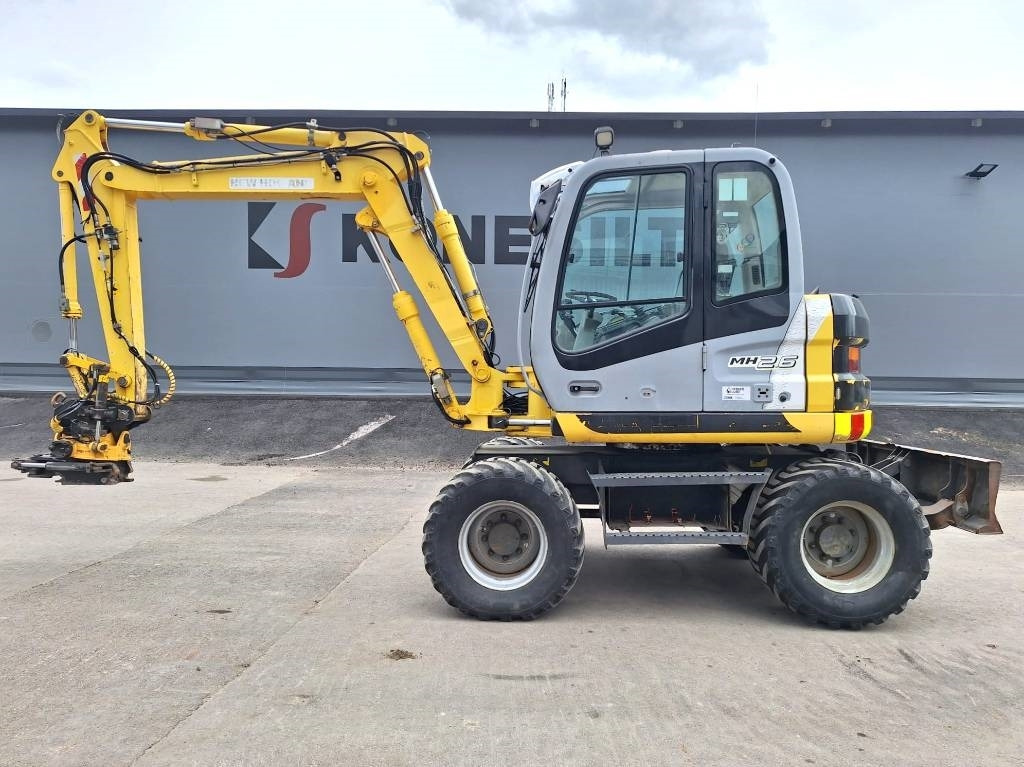 New Holland MYYTY! SOLD! MH2.6 ENGCON PIHDEILLÄ - حفار ذو عجلات: صورة 1 New Holland MYYTY! SOLD! MH2.6 ENGCON PIHDEILLÄ - حفار ذو عجلات: صورة 1