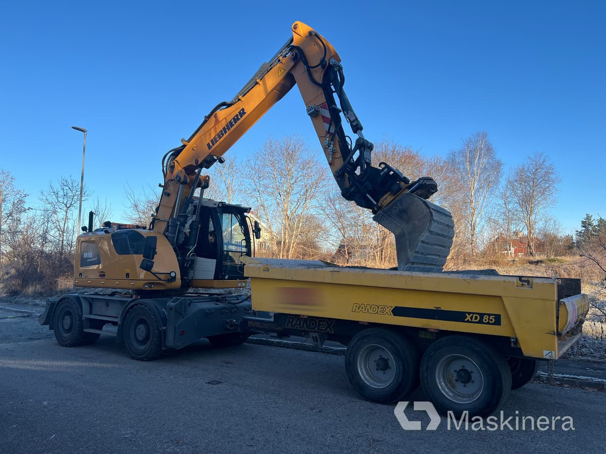 Hjulgrävare Liebherr 918 Compact Litronic med kärra - حفار زاحف: صورة 1 Hjulgrävare Liebherr 918 Compact Litronic med kärra - حفار زاحف: صورة 1