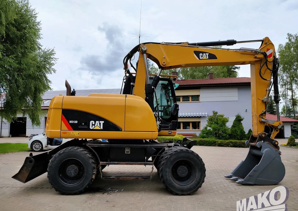 Caterpillar M313D - حفار ذو عجلات: صورة 5 Caterpillar M313D - حفار ذو عجلات: صورة 5