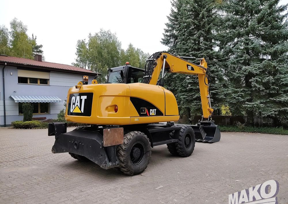 Caterpillar M313D - حفار ذو عجلات: صورة 4 Caterpillar M313D - حفار ذو عجلات: صورة 4
