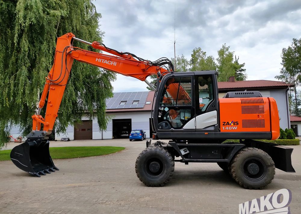 Hitachi ZX 140 - حفار ذو عجلات: صورة 1 Hitachi ZX 140 - حفار ذو عجلات: صورة 1