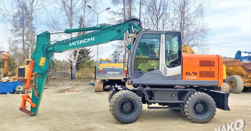 Hitachi ZX140W-3 - حفار ذو عجلات: صورة 1 Hitachi ZX140W-3 - حفار ذو عجلات: صورة 1