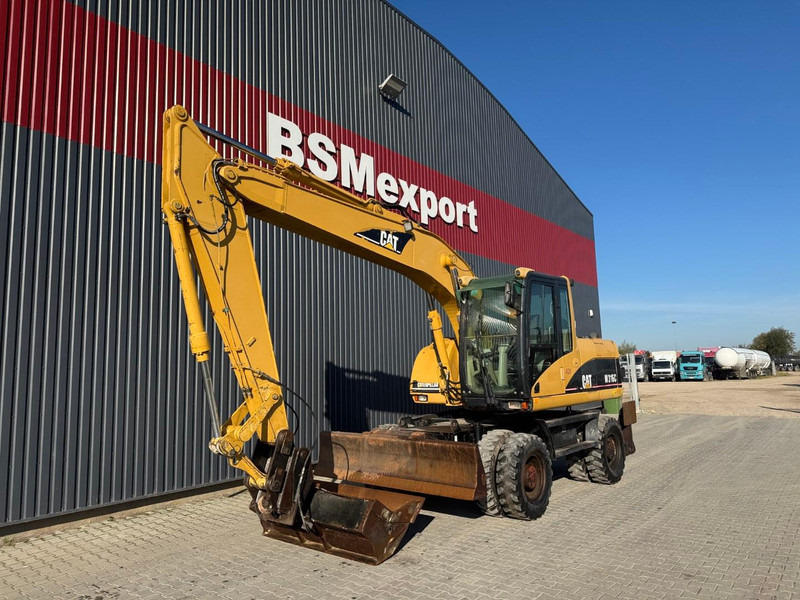 Caterpillar M 316 C - حفار ذو عجلات: صورة 1 Caterpillar M 316 C - حفار ذو عجلات: صورة 1