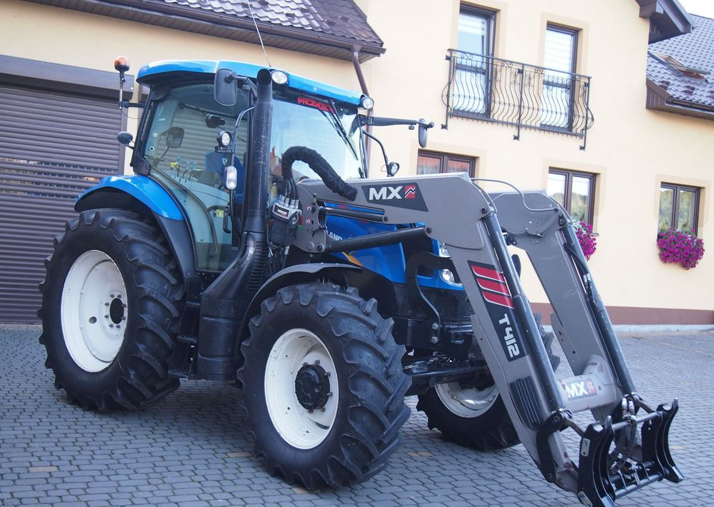 Ciągnik New Holland NH T6.140 2016 New Holland z Ładowaczem czołowym TUR - جرار: صورة 1 Ciągnik New Holland NH T6.140 2016 New Holland z Ładowaczem czołowym TUR - جرار: صورة 1