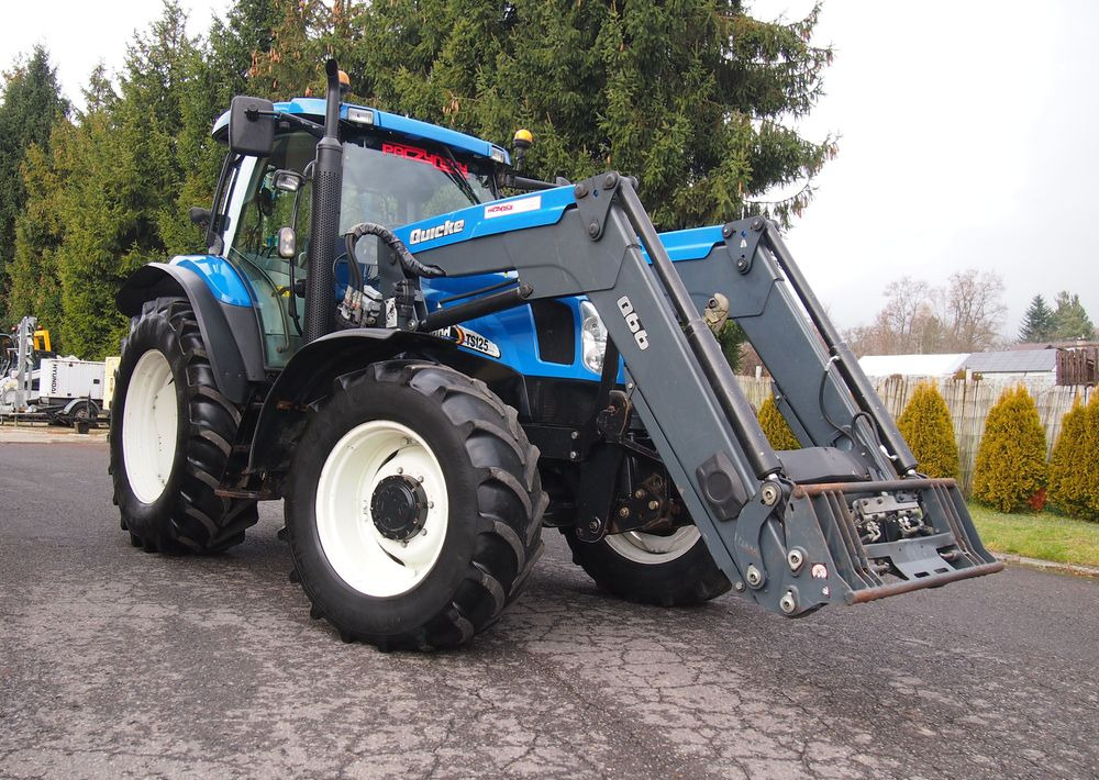 Ciągnik New Holland NH TS125A 6 cylindrów 2004 Ciągnik rolniczy New Holland TS125A - جرار: صورة 2 Ciągnik New Holland NH TS125A 6 cylindrów 2004 Ciągnik rolniczy New Holland TS125A - جرار: صورة 2