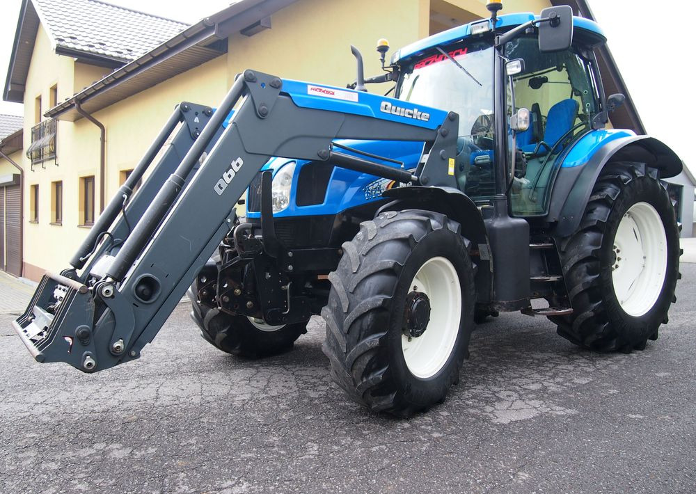 Ciągnik New Holland NH TS125A 6 cylindrów 2004 Ciągnik rolniczy New Holland TS125A - جرار: صورة 1 Ciągnik New Holland NH TS125A 6 cylindrów 2004 Ciągnik rolniczy New Holland TS125A - جرار: صورة 1