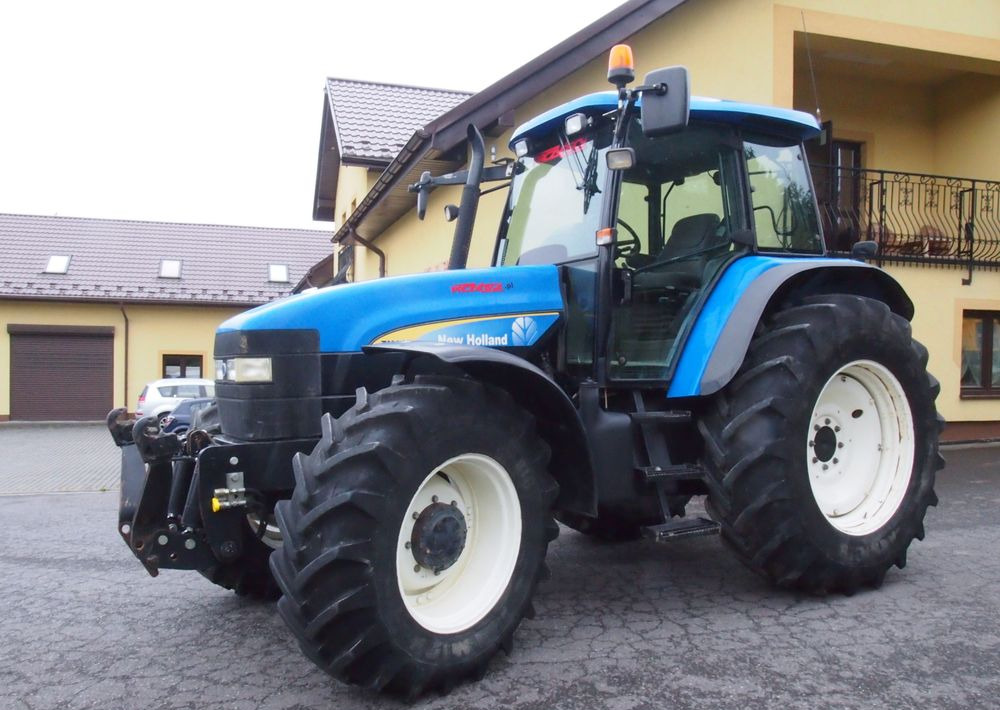 Ciągnik New Holland TM 140 2004 Przedni TUZ - جرار: صورة 3 Ciągnik New Holland TM 140 2004 Przedni TUZ - جرار: صورة 3