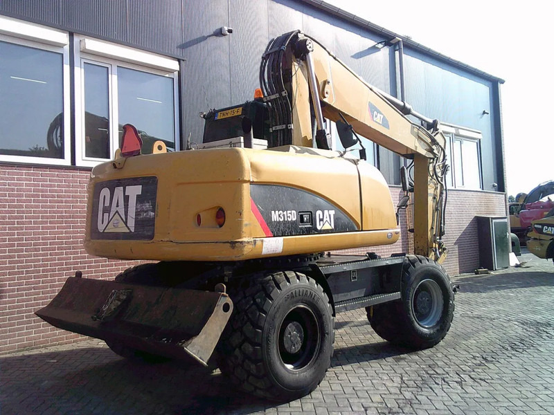 Caterpillar M315D - حفار ذو عجلات: صورة 3 Caterpillar M315D - حفار ذو عجلات: صورة 3