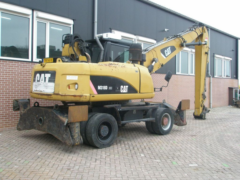 Caterpillar M318D - حفار ذو عجلات: صورة 4 Caterpillar M318D - حفار ذو عجلات: صورة 4