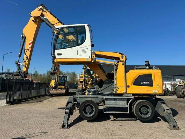 Liebherr LH22M - حفار ذو عجلات: صورة 1 Liebherr LH22M - حفار ذو عجلات: صورة 1