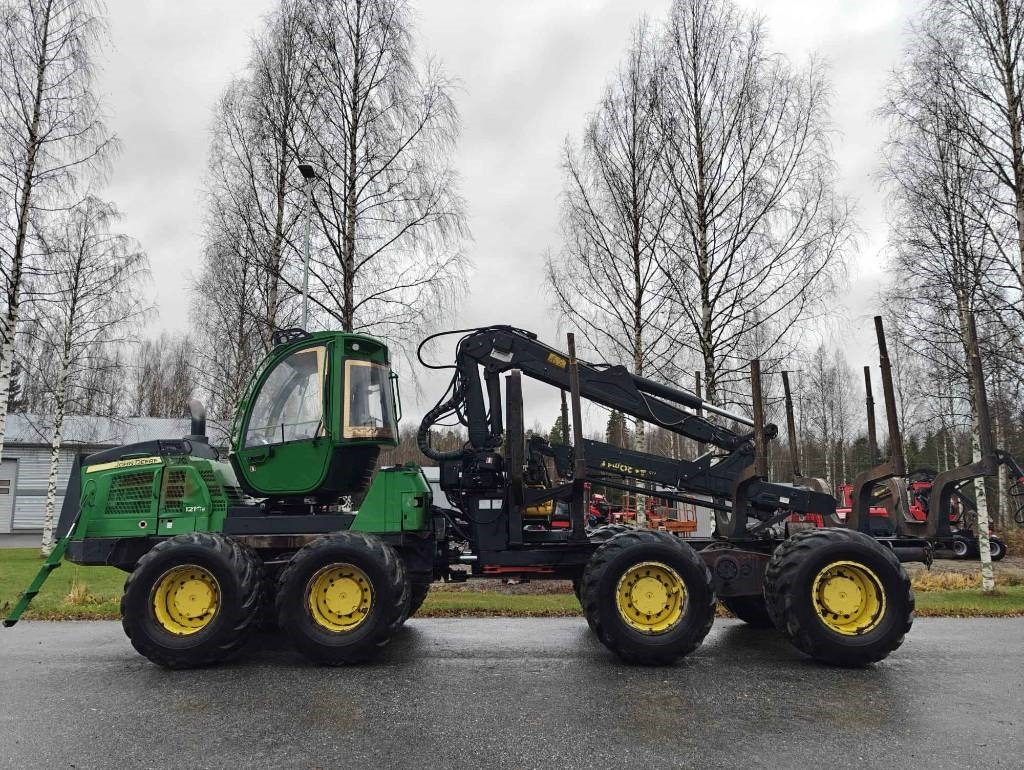 John Deere 1210 E - جرار شحن جذوع أشجار الغابات: صورة 2 John Deere 1210 E - جرار شحن جذوع أشجار الغابات: صورة 2