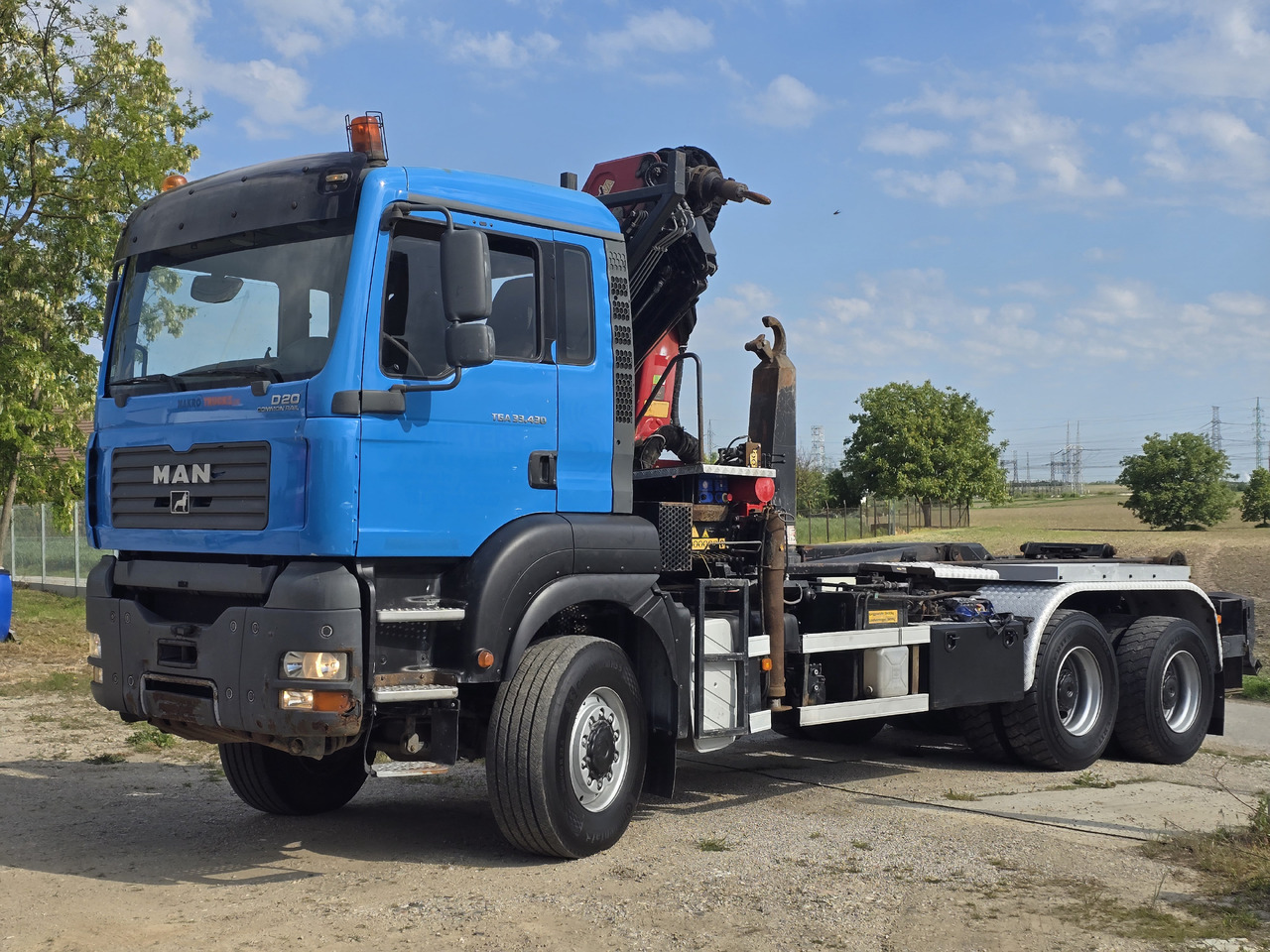 MAN TGA 33.430 6X6 / HMF 1823 K3+REM.CON./ HOOK SYSTEM 2x in stock - شاحنة برافعة خطافية, شاحنة كرين: صورة 3 MAN TGA 33.430 6X6 / HMF 1823 K3+REM.CON./ HOOK SYSTEM 2x in stock - شاحنة برافعة خطافية, شاحنة كرين: صورة 3