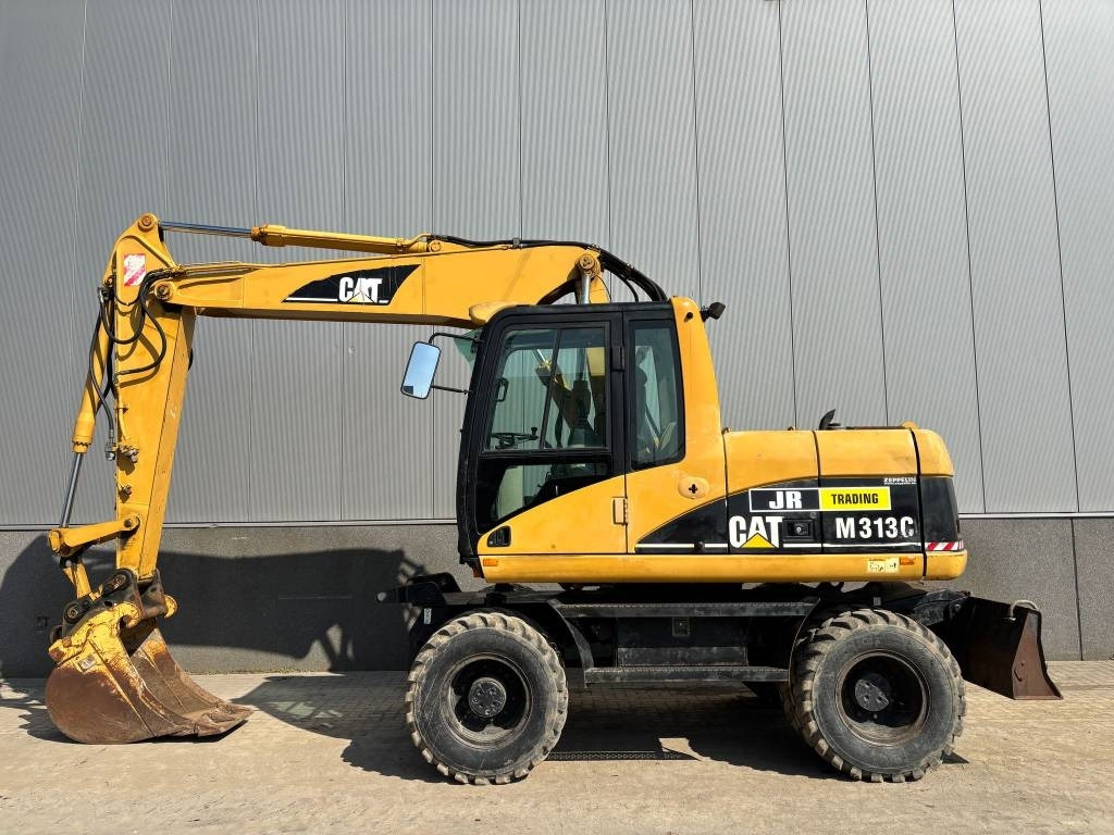 CAT M 313 C (Low verified hours) - حفار ذو عجلات: صورة 1 CAT M 313 C (Low verified hours) - حفار ذو عجلات: صورة 1