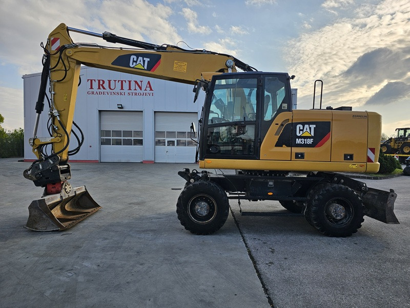 CATERPILLAR M318F - حفار ذو عجلات: صورة 1 CATERPILLAR M318F - حفار ذو عجلات: صورة 1