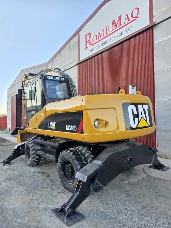 CAT M318D - حفار ذو عجلات: صورة 2 CAT M318D - حفار ذو عجلات: صورة 2