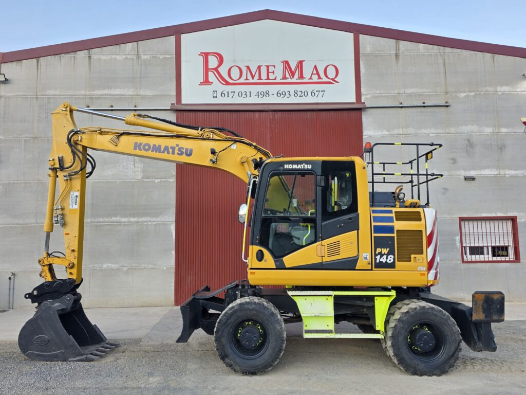 KOMATSU PW148-11 - حفار ذو عجلات: صورة 1 KOMATSU PW148-11 - حفار ذو عجلات: صورة 1