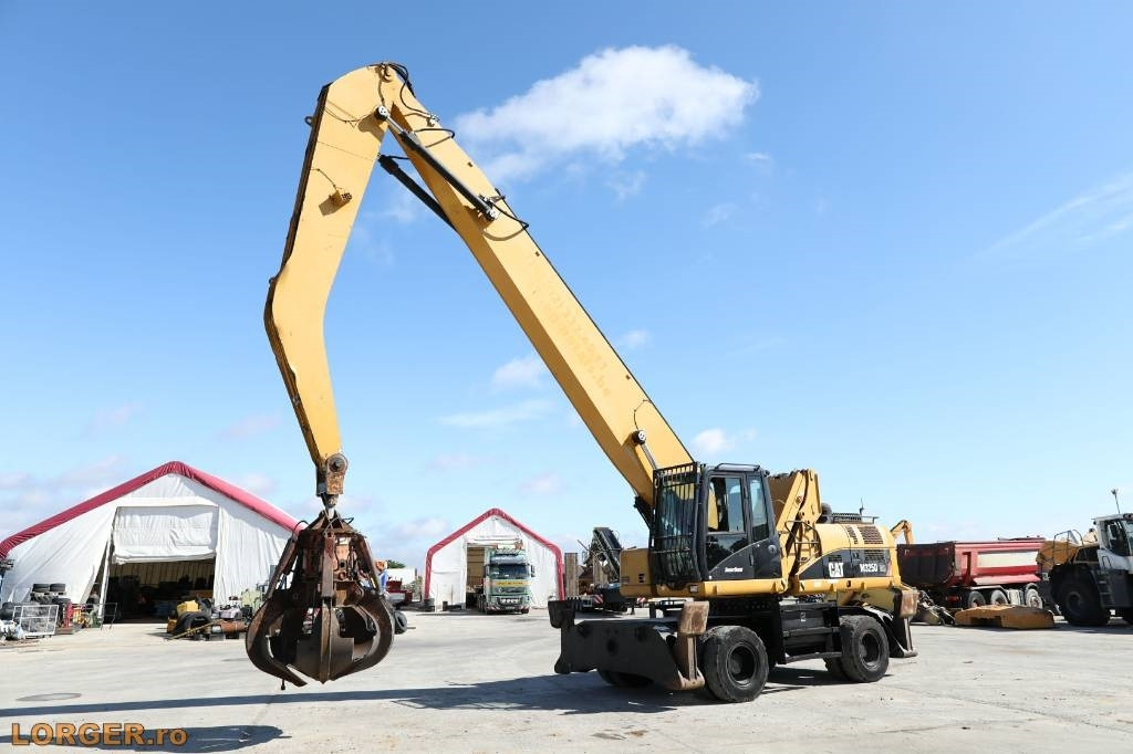 CAT M 325 D MH - آلة التعامل مع النفايات: صورة 1 CAT M 325 D MH - آلة التعامل مع النفايات: صورة 1