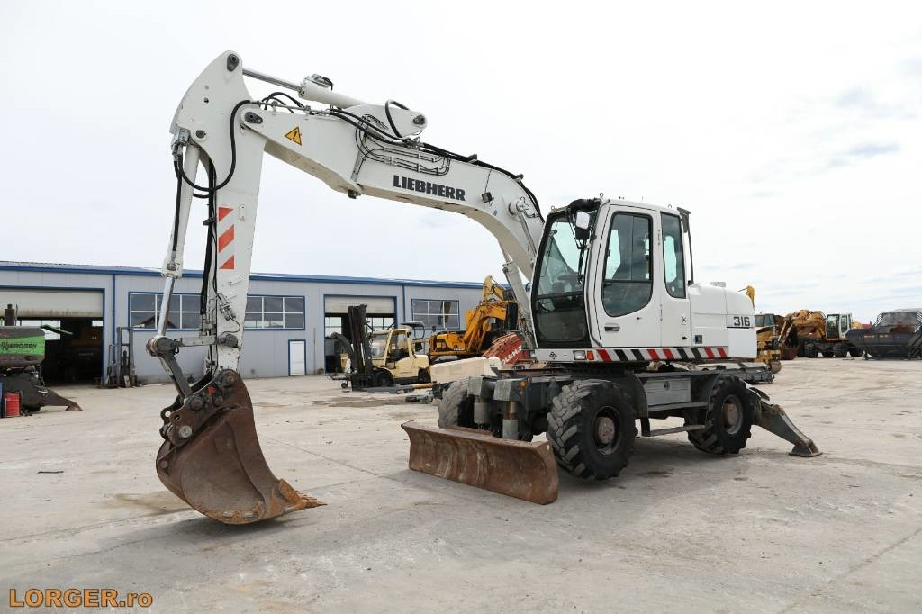 Liebherr A 316 Litronic - حفار ذو عجلات: صورة 5 Liebherr A 316 Litronic - حفار ذو عجلات: صورة 5