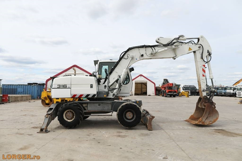 Liebherr A 316 Litronic - حفار ذو عجلات: صورة 1 Liebherr A 316 Litronic - حفار ذو عجلات: صورة 1