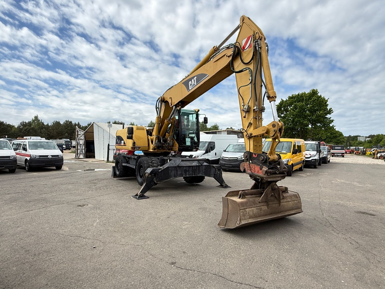 CAT M 322C - حفار ذو عجلات: صورة 1 CAT M 322C - حفار ذو عجلات: صورة 1