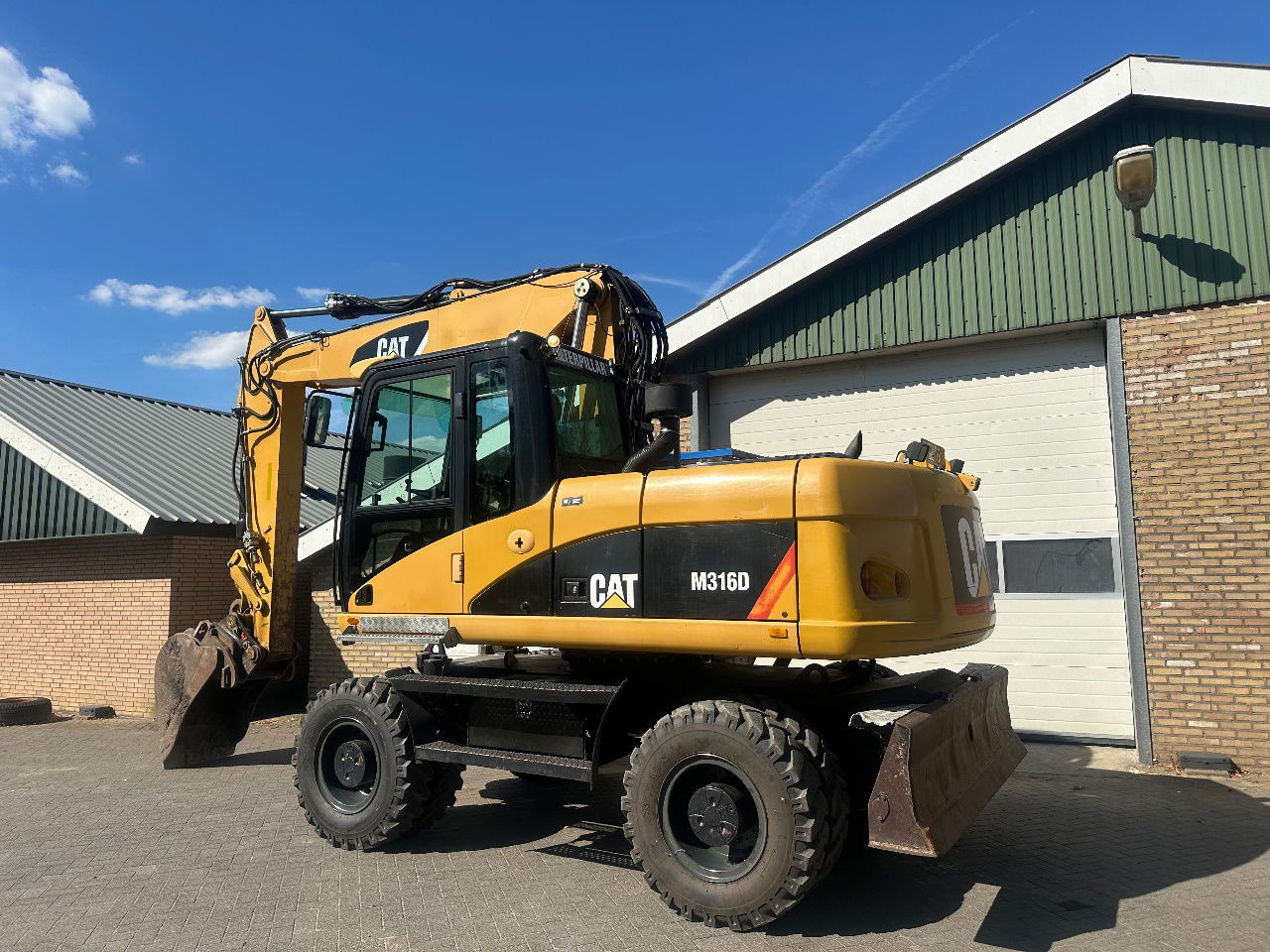 Caterpillar M316D - اللودر بعجل: صورة 2 Caterpillar M316D - اللودر بعجل: صورة 2