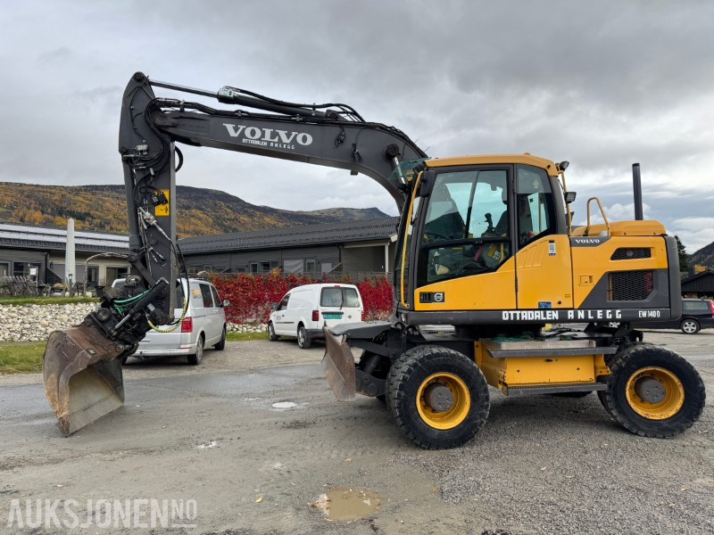 2012 Volvo EW140 D Hjulmaskin TILTROTATOR, 2 SKUFFER, SENTRALSMØRING - حفّار: صورة 1 2012 Volvo EW140 D Hjulmaskin TILTROTATOR, 2 SKUFFER, SENTRALSMØRING - حفّار: صورة 1