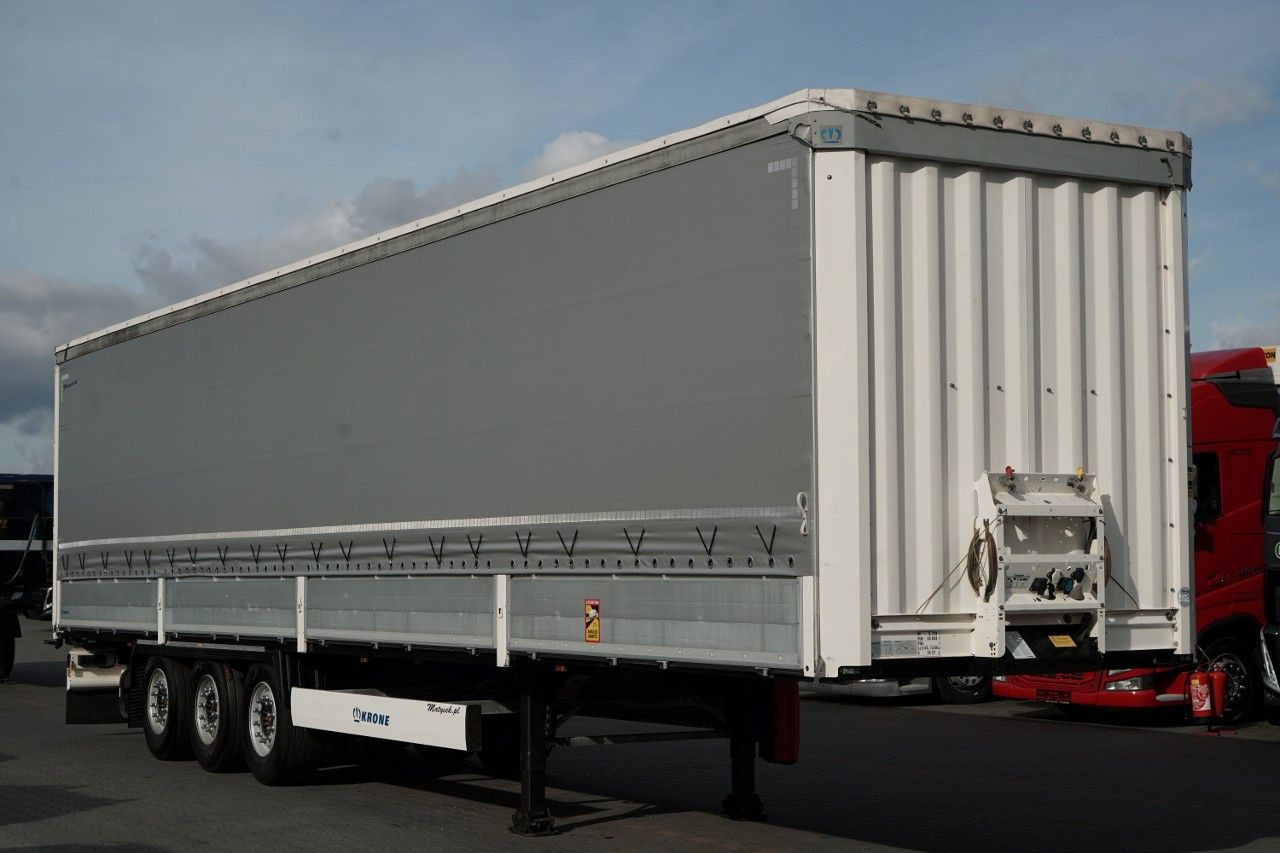 Krone FIRANKA / BURTOWA / OŚ PODNOSZONA / SAF / STANDA - نصف مقطورة بستائر جانبية: صورة 1 Krone FIRANKA / BURTOWA / OŚ PODNOSZONA / SAF / STANDA - نصف مقطورة بستائر جانبية: صورة 1