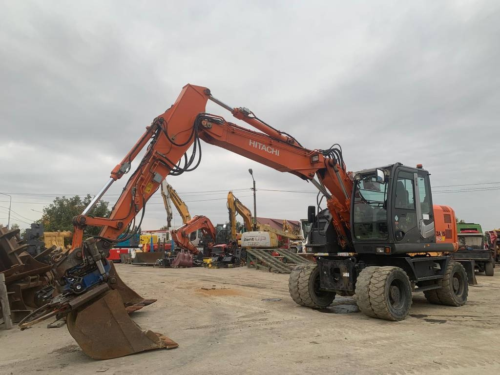 Hitachi ZX 145 W-3+SMP Rototilt  - حفار ذو عجلات: صورة 1 Hitachi ZX 145 W-3+SMP Rototilt  - حفار ذو عجلات: صورة 1